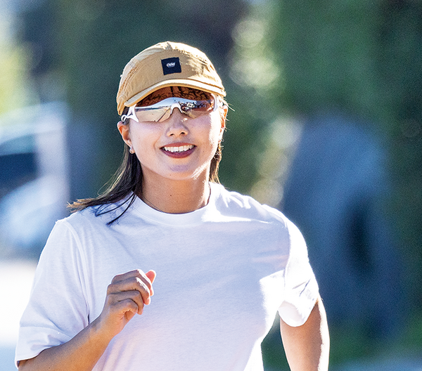 Runner wearing SWANS E-NOX EIGHT8 running sunglasses during a marathon